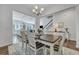 Open-concept dining room with views into the kitchen and living areas, showcasing the seamless flow of the home at 107 Willett Ln, Summerville, SC 29486