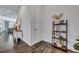Clean hallway with wood-look flooring, neutral paint, and decorative shelving creating an inviting entrance at 107 Willett Ln, Summerville, SC 29486