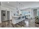 Open kitchen with a center island, stainless steel appliances, and view to the outdoor living area at 107 Willett Ln, Summerville, SC 29486
