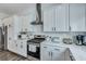 Well-equipped kitchen with stainless steel appliances, ample counter space, and white cabinetry at 107 Willett Ln, Summerville, SC 29486