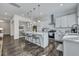 Open kitchen with a center island, stainless steel appliances, and view to the outdoor living area at 107 Willett Ln, Summerville, SC 29486