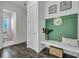View of mudroom with built-in bench and storage, coat hooks, and decor at 107 Willett Ln, Summerville, SC 29486
