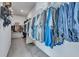 Spacious walk-in closet with rows of hanging clothes, shelves, and carpeted floor at 107 Willett Ln, Summerville, SC 29486