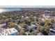 Scenic aerial view showcasing a dense neighborhood near a bay with a bridge in the distance at 108 Rose Ln, Mount Pleasant, SC 29464