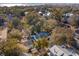 Aerial shot of a quiet neighborhood featuring charming homes surrounded by lush, mature trees and serene streets at 108 Rose Ln, Mount Pleasant, SC 29464