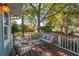 Relaxing back porch with cozy seating, ideal for enjoying the serene backyard at 108 Rose Ln, Mount Pleasant, SC 29464