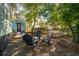 Inviting backyard features a gravel seating area with modern chairs and a fire pit for outdoor enjoyment at 108 Rose Ln, Mount Pleasant, SC 29464