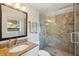 Elegant bathroom featuring a granite vanity, glass-enclosed shower, and neutral tones at 108 Rose Ln, Mount Pleasant, SC 29464