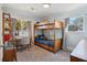 Bright bedroom with bunk beds, study desk, and a sunny window view at 108 Rose Ln, Mount Pleasant, SC 29464