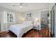 Bright bedroom with white bedding, natural light, and decorative accents at 108 Rose Ln, Mount Pleasant, SC 29464