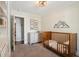 Cozy Bedroom features a crib, dresser, and mountain-themed decor at 108 Rose Ln, Mount Pleasant, SC 29464