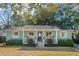 Charming single-story home featuring a covered front porch and well-maintained landscaping at 108 Rose Ln, Mount Pleasant, SC 29464