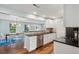 Modern kitchen with stainless steel appliances and granite countertops open to the dining area at 108 Rose Ln, Mount Pleasant, SC 29464