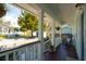 Inviting front porch with rocking chair and garden view at 108 Rose Ln, Mount Pleasant, SC 29464