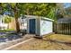 Well-maintained outdoor storage shed with light blue siding and a dark blue door and concrete foundation at 108 Rose Ln, Mount Pleasant, SC 29464