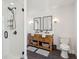 Bathroom featuring double sink vanity, framed mirrors, modern fixtures, and glass enclosed shower at 109 Buckingham Ave, Summerville, SC 29485