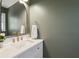 Modern bathroom with a sleek vanity, gold fixtures, and stylish decor at 109 Buckingham Ave, Summerville, SC 29485