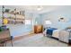 A beautifully staged bedroom with built-in shelving, natural lighting, and tasteful decor at 109 Buckingham Ave, Summerville, SC 29485