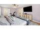 Bedroom showcasing mounted TV, light-colored walls, closet access, and ceiling fan at 109 Buckingham Ave, Summerville, SC 29485