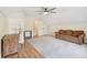 Spacious bonus room featuring a ceiling fan, a cozy couch, and a dedicated work space at 109 Buckingham Ave, Summerville, SC 29485