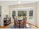 Cozy breakfast nook features a bay window with backyard views, a table, and chairs on an area rug at 109 Buckingham Ave, Summerville, SC 29485