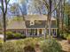 Charming two-story brick home with a welcoming front porch and well-manicured landscaping at 109 Buckingham Ave, Summerville, SC 29485