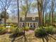 Well-maintained two-story home with a welcoming front porch, mature trees, and landscaping at 109 Buckingham Ave, Summerville, SC 29485