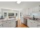 Spacious kitchen with stainless steel appliances, granite countertops, and views of the backyard and breakfast nook at 109 Buckingham Ave, Summerville, SC 29485