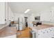 Bright kitchen with stainless steel appliances, white cabinets, hardwood floors and granite countertops at 109 Buckingham Ave, Summerville, SC 29485