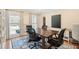 Large home office with a big desk, comfortable chairs, hardwood floors, and lots of light at 109 Buckingham Ave, Summerville, SC 29485