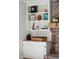 Close-up of the shelving unit, featuring decor and personal touches on the custom shelves at 109 Buckingham Ave, Summerville, SC 29485