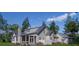 Gray home exterior with screened-in porch, metal roof and brick chimney at 111 Peninsula Dr, Ravenel, SC 29470