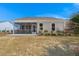 Backyard featuring a screened-in porch and well-maintained landscaping at 1174 Old Field Dr, Summerville, SC 29483