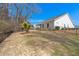 Wide view of the backyard featuring an enclosed porch, fence, and landscaping at 1174 Old Field Dr, Summerville, SC 29483