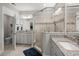 Bright bathroom with double sinks, granite countertops, and a spacious glass shower at 1174 Old Field Dr, Summerville, SC 29483