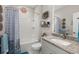 Cozy bathroom with granite countertops, a shower-tub combo, and decorative accents at 1174 Old Field Dr, Summerville, SC 29483