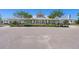 Community clubhouse with a gray roof and light green siding, adorned with plants and landscaping at 1174 Old Field Dr, Summerville, SC 29483