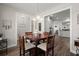 Open-concept dining area with hardwood floors, neutral walls, and seamless transition to the kitchen at 1174 Old Field Dr, Summerville, SC 29483