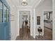 Bright entryway with hardwood floors, neutral walls, and stylish decor leading to various rooms in the home at 1174 Old Field Dr, Summerville, SC 29483