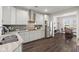 Modern kitchen with sleek countertops, stainless steel appliances, and an open view into the dining area at 1174 Old Field Dr, Summerville, SC 29483