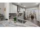 Open kitchen with granite countertops, stainless appliances and a view to the breakfast nook at 1174 Old Field Dr, Summerville, SC 29483