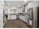 Bright kitchen boasts stainless steel appliances, granite countertops and ample cabinet space at 1174 Old Field Dr, Summerville, SC 29483