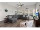 Inviting living room with a comfortable gray sectional and natural light from large windows at 1174 Old Field Dr, Summerville, SC 29483