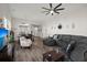 Bright and airy living room featuring a large sectional sofa and wood-look flooring at 1174 Old Field Dr, Summerville, SC 29483