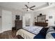 Bright main bedroom featuring an en-suite bathroom, dresser, and wood-look flooring at 1174 Old Field Dr, Summerville, SC 29483