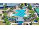 Aerial view of a community pool with lounge chairs, a jacuzzi, and a covered pavilion at 1174 Old Field Dr, Summerville, SC 29483