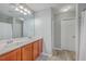 Bathroom featuring a double vanity with wood cabinets, a large mirror, and great lighting at 118 Lamplighter Ln, Summerville, SC 29486