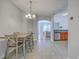 Open-concept dining room leading to the kitchen and living area at 118 Lamplighter Ln, Summerville, SC 29486