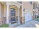 Charming townhome entrance with a black door and brick accents at 118 Lamplighter Ln, Summerville, SC 29486