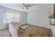 Cozy living room with wood floors, stylish curtains, and a comfortable couch with colorful pillows at 118 Lamplighter Ln, Summerville, SC 29486